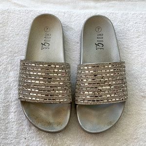 Silver, bedazzled flip flops. Size 7.